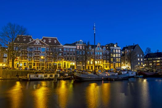 City scenic from Amsterdam with the in the Netherlands at sunset
