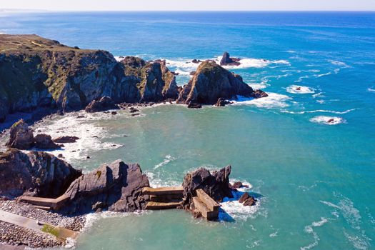 Aerial from Rocks and ocean near Azenha do Mar on the west coast in Portugal