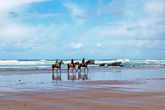 Horse riding at Carapateira beach in the Algarve Portugal