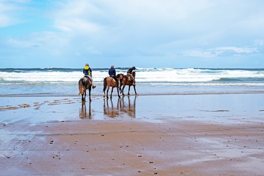 Horse riding at Carapateira beach in the Algarve Portugal