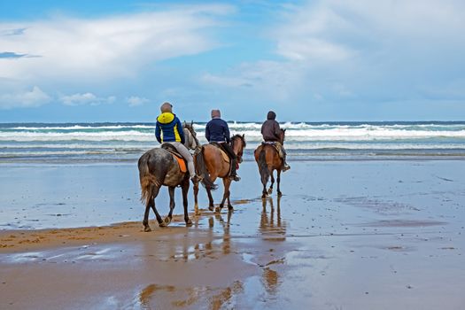 Horse riding at Carapateira beach in the Algarve Portugal