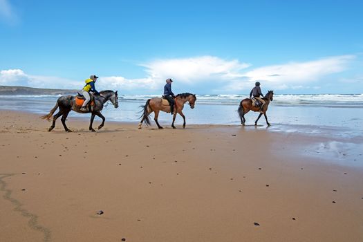 Horse riding at Carapateira beach in the Algarve Portugal