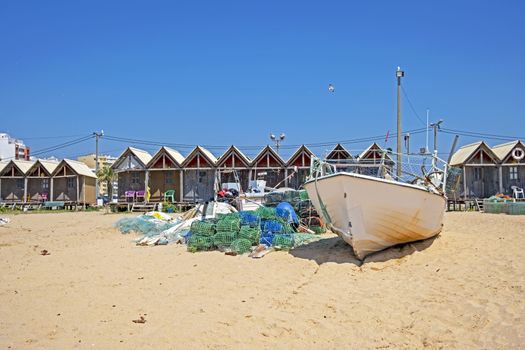 Traditonal fisherman huts on the beach in Armacao de Pera in the Algarve Portugal