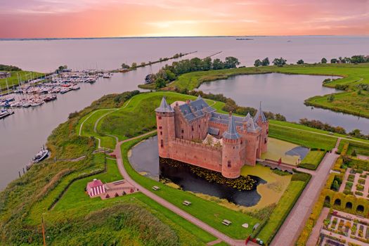 Aerial from medieval castle 'Muiderslot' in the countryside from the Netherlands at sunset