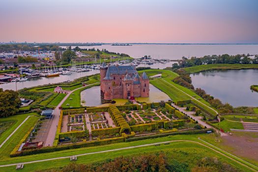 Aerial from medieval castle 'Muiderslot' in the countryside from the Netherlands at sunset