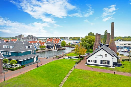 Aerial from traditional brick factory and houses in Huizen the Netherlands