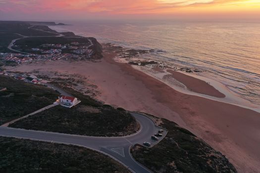 Aerial from Monte Clerigo at the west coast in Portugal at sunset