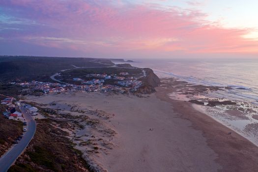 Aerial from Monte Clerigo at the west coast in Portugal at sunset