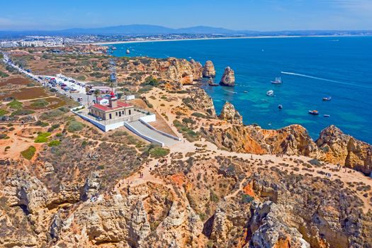 Aerial from natural rocks and the lighthouse at Ponte Piedade in Lagos Portugal