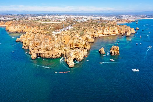Aerial from natural rocks and the lighthouse at Ponte Piedade in Lagos Portugal