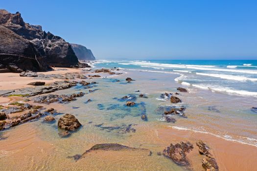 Aerial from Vale Figueiras beach on a beautiful summer day in Portugal
