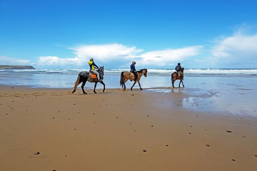Horse riding at Carapateira beach in the Algarve Portugal