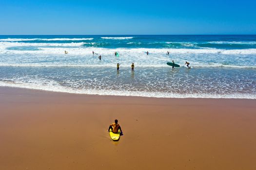 Vale Figueiras, Portugal - 25th may 2019: Aerial from surfers getting surfing lessons in the ocean