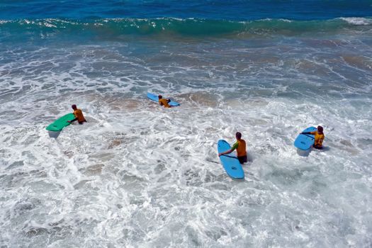Vale Figueiras, Portugal - 25th may 2019: Aerial fromsurfers getting surfing lessons in the ocean