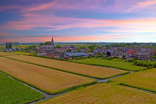 Aerial from a traditional dutch village in the countryside from the Netherlands