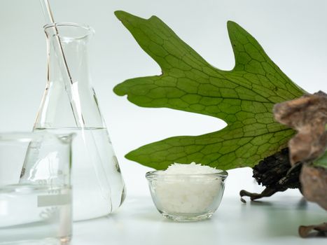 Cosmetic chemicals ingredient on white laboratory table. Microcrystalline wax, alcohol. 