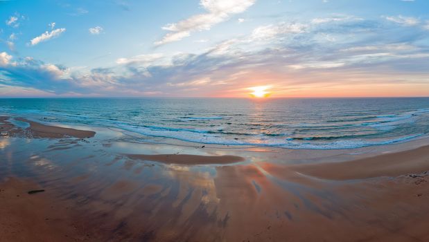 Panorama from Praia Vale Figueiras in Portugal at sunset