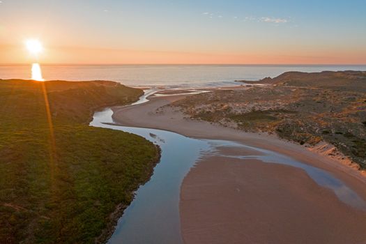 Aerial from Amoreira beach on the westcoast in Portugal at sunset