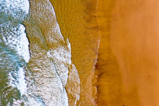Aerial top shot from the ocean at the beach