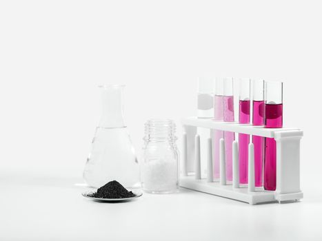 Cosmetic chemicals ingredient on white laboratory table. Potassium Permanganate,  Alcohol, Microcrystalline wax.