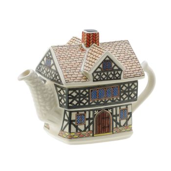 A house shaped teapot on white background with clipping path