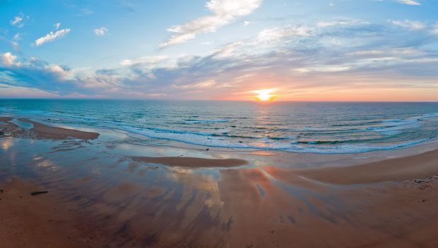 Panorama from Praia Vale Figueiras in Portugal at sunset