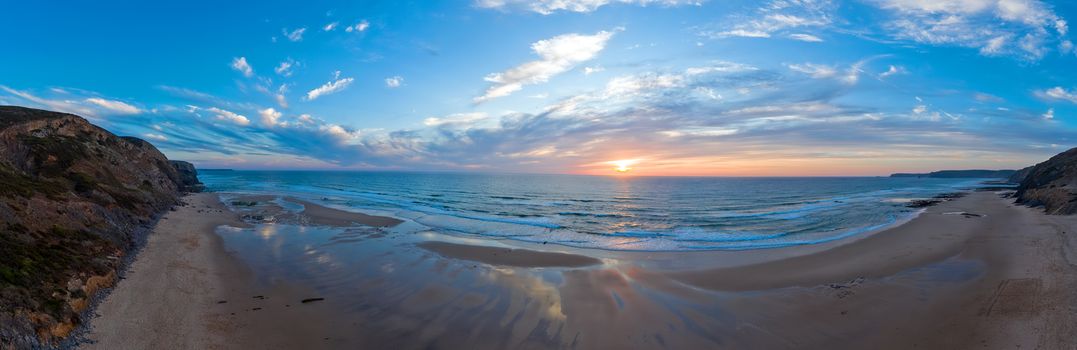 Panorama from Praia Vale Figueiras in Portugal at sunset