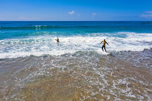 Vale Figueiras, Portugal - June 14, 2019: Aerial from surfers getting surfing lessons at Praia Vale Figueiras in Portugal