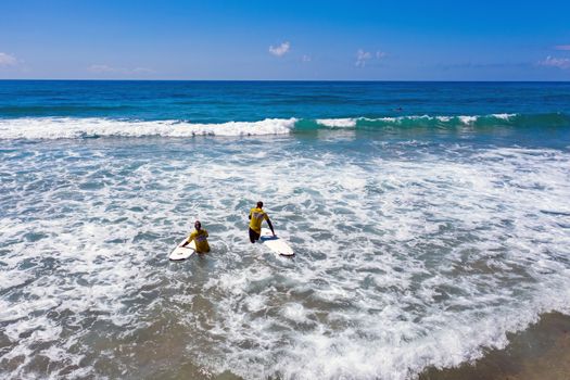 Vale Figueiras, Portugal - June 14, 2019: Aerial from surfers getting surfing lessons at Praia Vale Figueiras in Portugal