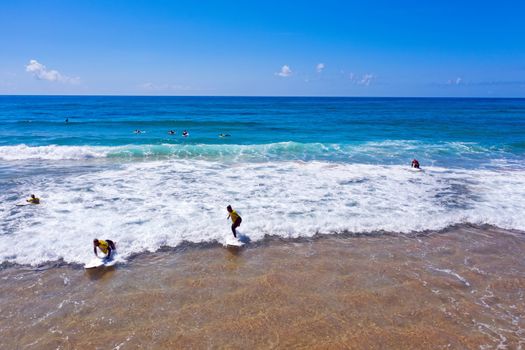 Vale Figueiras, Portugal - June 14, 2019: Aerial from surfers getting surfing lessons at Praia Vale Figueiras in Portugal