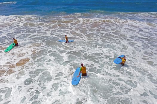 Vale Figueiras, Portugal - 25th may 2019: Aerial from surfers getting surfing lessons in the ocean