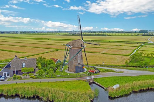 Aerial from a traditional windmill in the countryside from the Netherlands