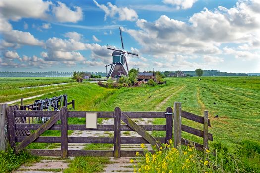 Landscape with a traditional windmill in the countryside from the Netherlands