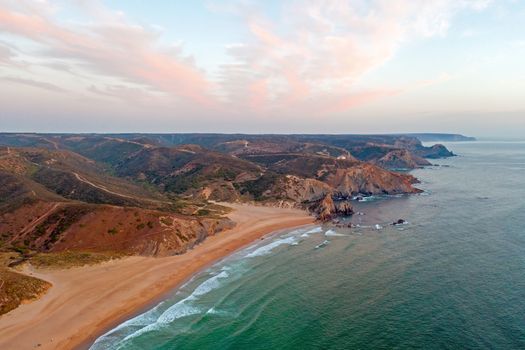Aerial on Praia Amado on the west coast in Portugal at sunset