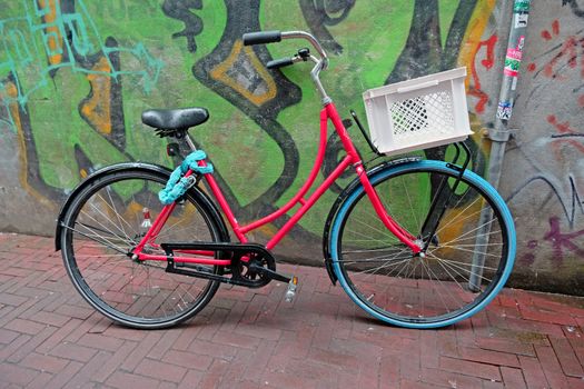 Dutch bike against a grafitti wall in Amsterdam the Netherlands