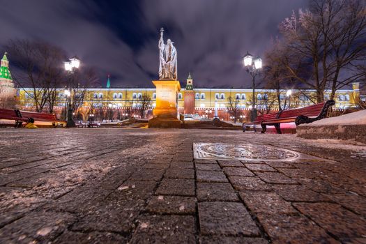 Statue of Hermogenes (Germogen), the Patriarch of Moscow and all Russia in front of a Kremlin Wall in Alexander Garden in Moscow