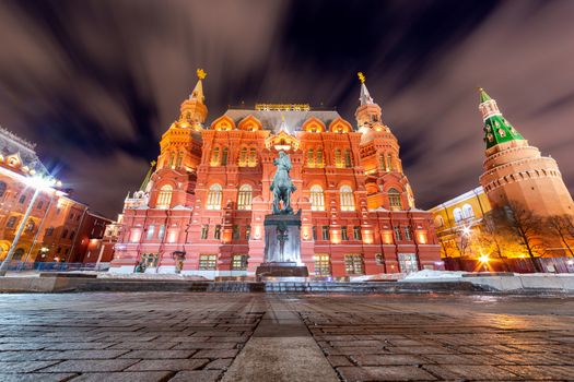 The monument of Marshal of Soviet Union G. K. Zhukov and State Historical Museum, in Moscow Russia during winter night