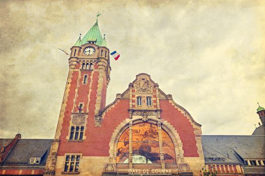 Old train station of Alsace touristic city Colmar with retro style filter