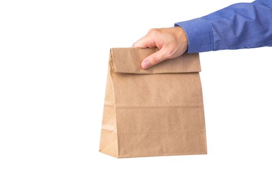 Man holding a brown paper bag isolated on white