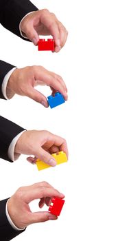 hand stacking a plastic block