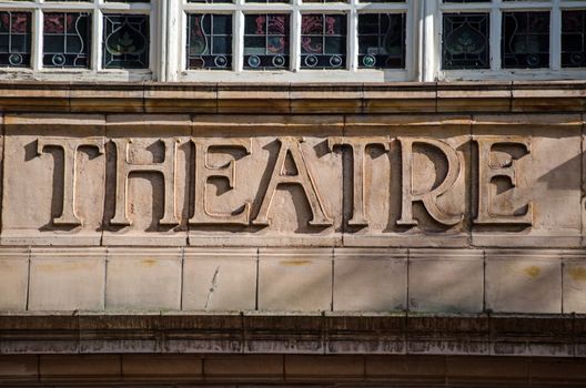 Terracotta tile sign saying 'Theatre' at the entrance to the historic venue in Richmond-Upon-Thames, West London.  The Victorian theatre was designed by Frank Matcham.