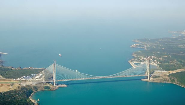Aerial view of the Third Bosphorus Bridge, the Yavuz Sultan Selim Bridge close to the Black Sea.  Linking Europe and Asia, north of Istanbul, the bridge carries both a motorway and railway line.