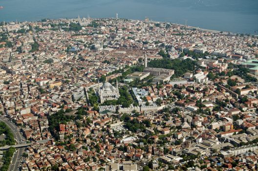 Aerial view of the old city of Istanbul with the mosques of Murat Pasa Camii, Beyazit Camii, and the famous Blue Mosque dominating the skyline.