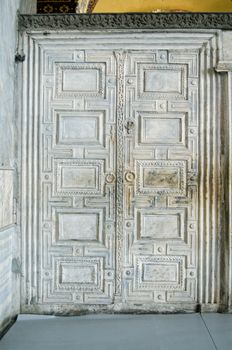 A solid wall of mable carved to look like an ornate door in the Hagia Sophia, Istanbul, Turkey.  Made in the 6th century, it was at the entrance to the Emperor's private chambers.