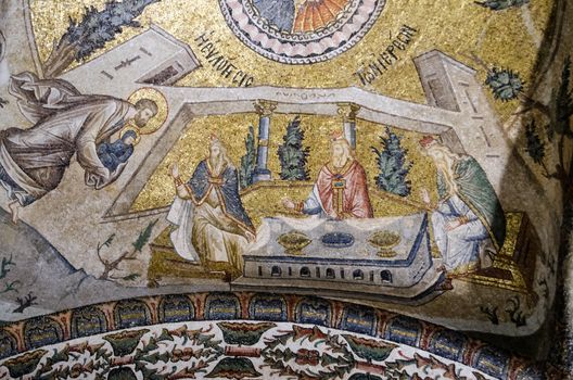 Historic Medieval Byzantine mosaic showing St Joachim presenting the baby St Mary to priests at a temple.  Ceiling of the Chora Church in Istanbul, Turkey.
