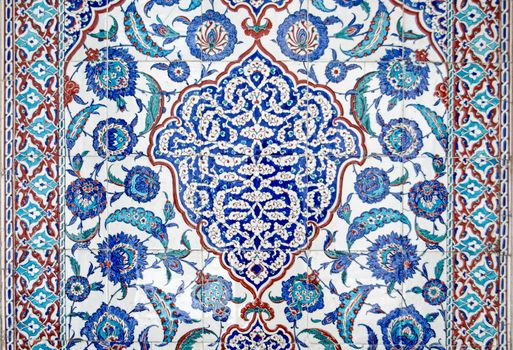 Detail of a wonderful pattern made in Iznik tiles on the exterior of the historic tomb of Sultan Murad III built in 1599.  On public display in the old city of Istanbul, Turkey.