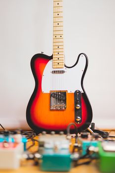 Electric guitar and effect pedals in the recording studio. Concept of creating guitar music, recording or rehearsing