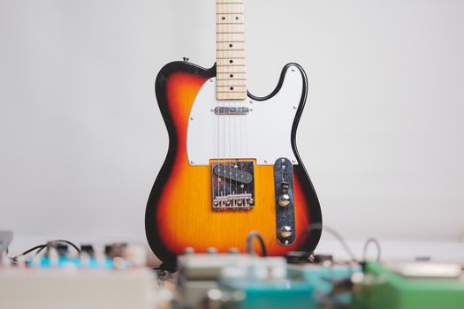 Electric guitar and effect pedals in the recording studio. Concept of creating guitar music, recording or rehearsing