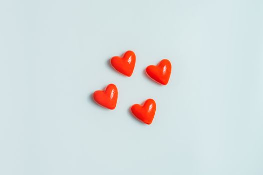 Close up view of four  hearts on a gray background. Valentine's day concept