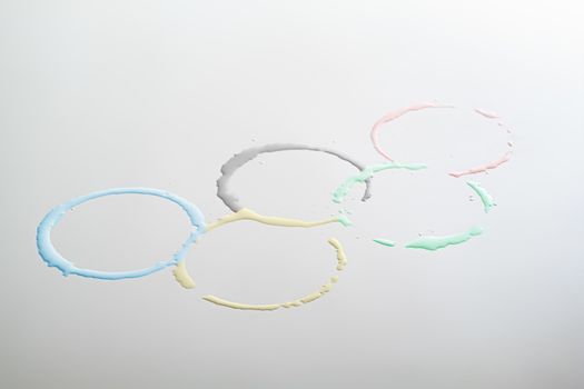 The Olympic Games sign in the form of colored water circles. Concept of sports, competition or water sports at the olympic games